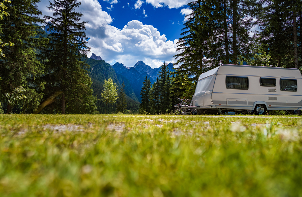 travel trailer rv at rv site in mountains