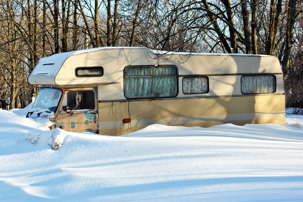 trailer parked at house in winter
