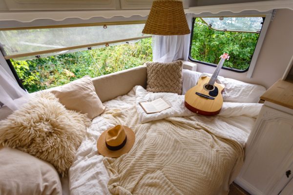 A guitar and hat inside the RV