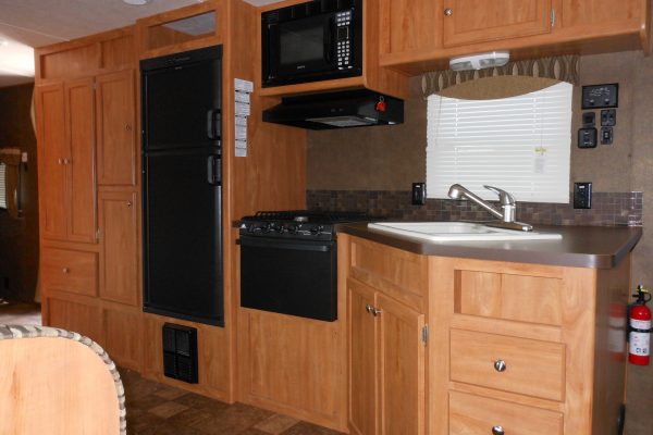 Large travel trailer kitchen with upgraded amenities