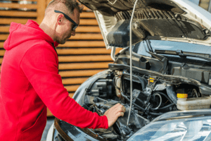 a Man checks his RV engine before a road trip. 